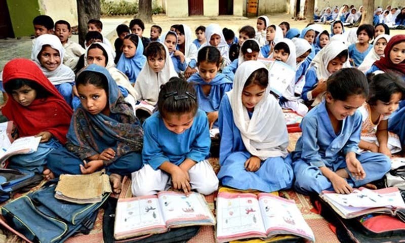 Rural Pakistani students learning with traditional and modern methods